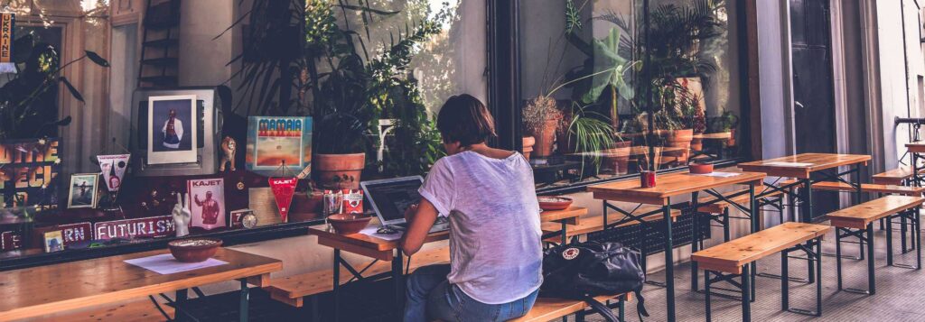 Person in Café Shop working